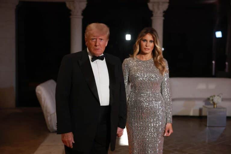 PALM BEACH, FLORIDA - DECEMBER 31: Former U.S. President Donald Trump and former first lady Melania Trump arrive for a New Years event at his Mar-a-Lago home on December 31, 2022 in Palm Beach, Florida. Trump continues to run for a second term as the President of the United States. (Photo by Joe Raedle/Getty Images)