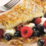 You’re just 4 steps away from the ultimate breakfast egg wrap with a fruity twist – recipe