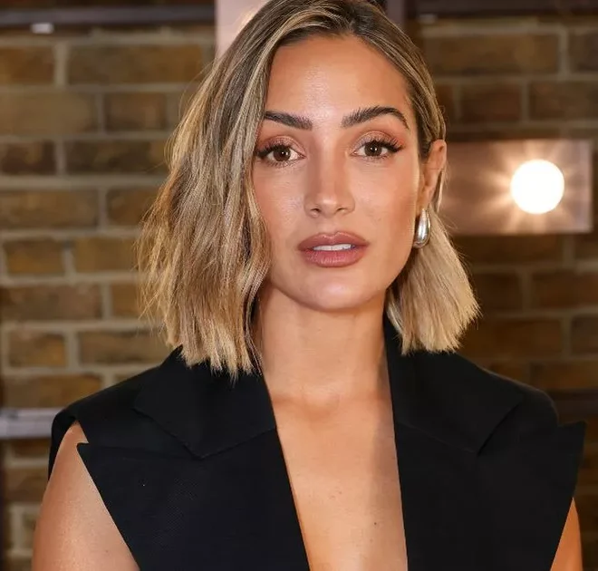 Frankie Bridge’s burgundy Antler suitcase is perfect for packing for Paris Fashion Week