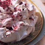 Show your mum some TLC with this delicate rose and rhubarb fool pavlova that’s ‘baked with love’
